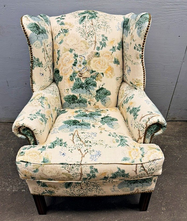Floral linen wing chair with brass nailhead trim